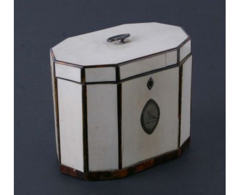 A George III ivory and tortoiseshell inlaid tea caddy of ten sided form, the hinged lid with silver handle, the front with na