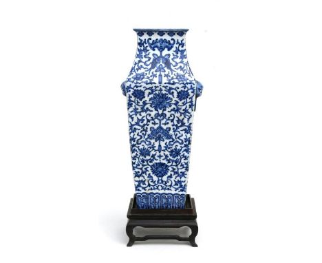 A large Chinese blue &amp; white two-handed vase of square tapering form, decorated with scrolling flowering foliage with squ