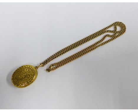 9ct gold curb link chain with a yellow metal double sided locket with foliate engraving, approx. overall weight 28g 