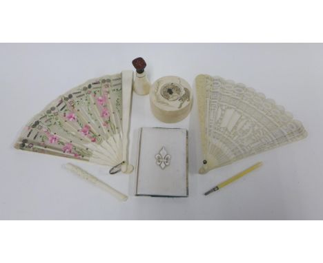 A collection of late 19th and early 20th century ivory items to include a trinket box, aide memoire, intaglio seal, fans, etc