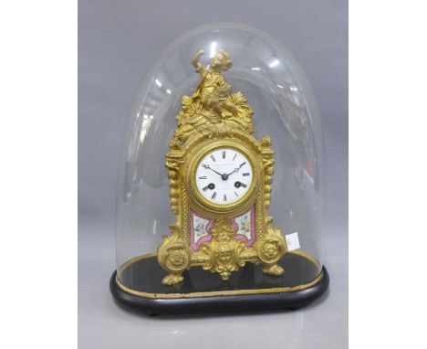 French gilt metal and porcelain mantle clock, the dial with black roman numerals, and signed Martin Baskett, with glass dome 