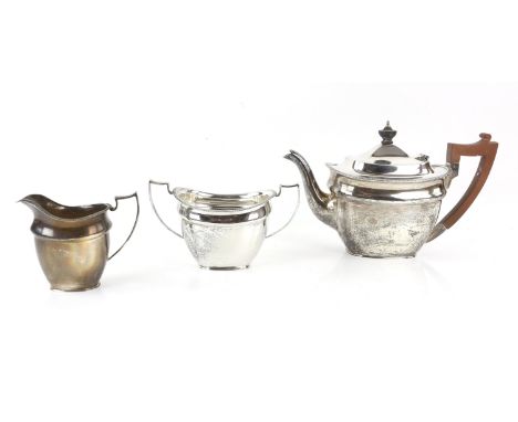 George V silver three piece tea service with gadrooned rims, comprising teapot, cream jug and sugar bowl, by Martin, Hall & C