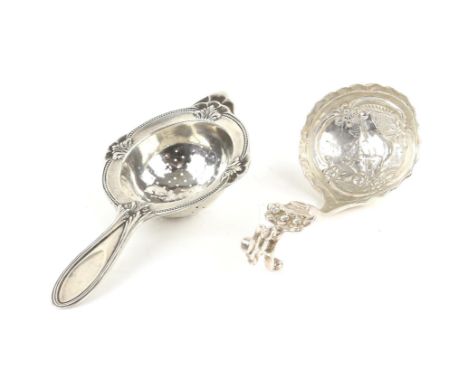 Continental silver caddy spoon and an 830 grade silver tea strainer
