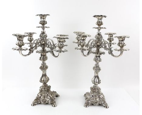 Pair of German silver plated five-light candelabra by Henniger, on waisted columns, shaped bases and four feet, each 49cm hig