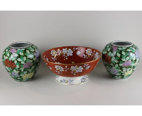 A pair of Chinese porcelain vases with all over decoration of coloured chrysanthemums and green foliage, 19cm high, and a Rea