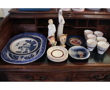 A Nao figure of a lady holding a rabbit, 28cm high, a Royal Doulton figure, Darling, 19cm high, a Crownford tea set, a blue a