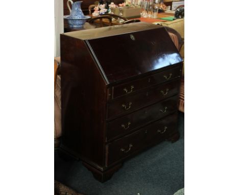 A George III mahogany bureau with internal pigeon holes and drawers above four graduated drawers on bracket feet, 95cm