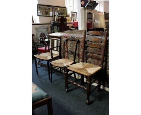 A ladder back dining chair and two other rush seated chairs