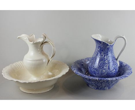 A Royal Creamware water ewer and basin, together with another blue and white transfer decorated water ewer and basin