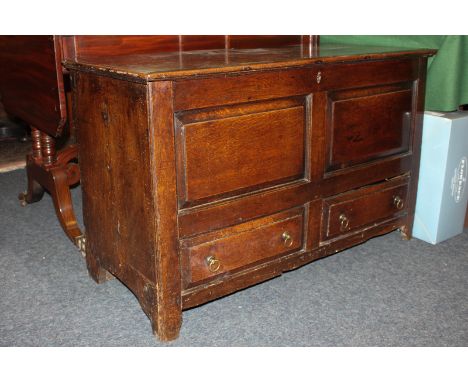 An 18th century oak mule chest with panelled front and two drawers, on bracket feet, 101cm
