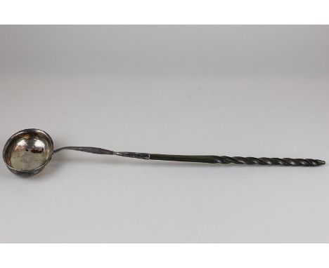 A Georgian brandy ladle with twisted whalebone handle, 37cm