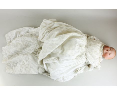 An Armand Marseille bisque headed doll of a baby, marked AM Germany 351.1372, with sleeping eyes and open mouth, composite ha