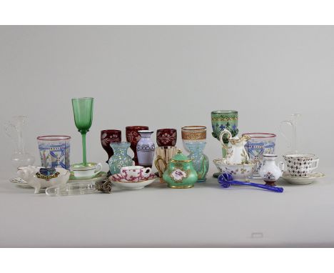 A collection of miniature glass and porcelain cups and saucers, glasses, vases, etc