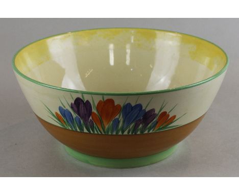 A Clarice Cliff crocus pattern fruit bowl with Wilkinson honeyglaze and gilt printed Clarice Cliff marks to base, 23cm