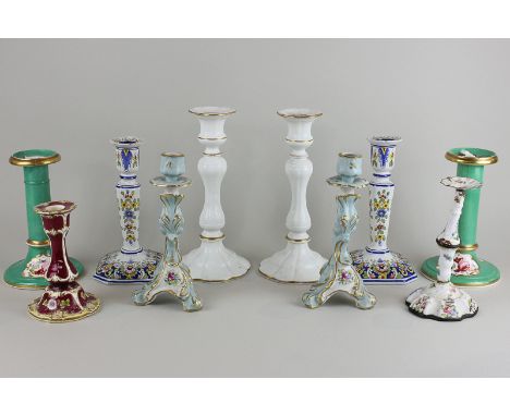 A pair of Delftware candlesticks, 19cm, three other pairs of candlesticks, a single porcelain candlestick and an enamel candl
