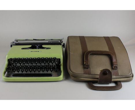 An Olivetti Lettera 22 typewriter in carry case with manual