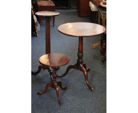 A George III mahogany circular tripod table, 51cm, a later oak jardiniere stand and a wine table (3)