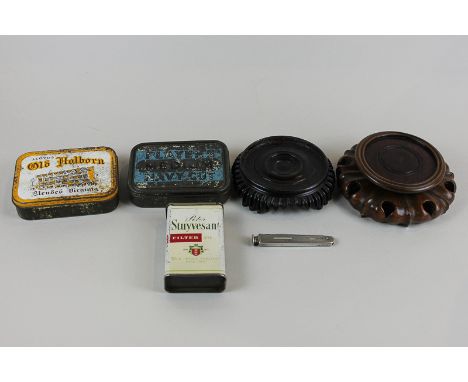 A pipe smoker's silver penknife a Peter Stuyvesant cigarette tin, two other tins and two oriental wood stands