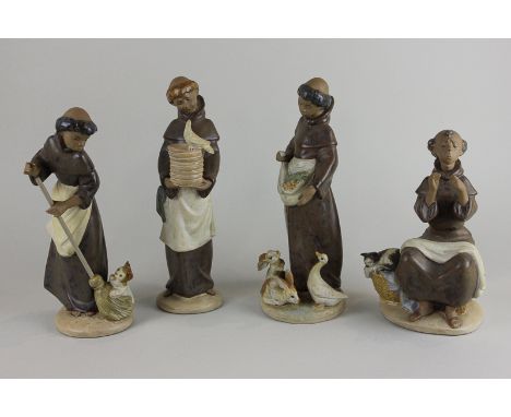 Four Lladro figures of monks with various animals, tallest 23cm high