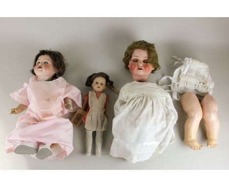 A Heubach Köppelsdorf bisque headed doll, 320.4 (needs re-stringing), an Armand Marseille bisque headed doll, 990 (a/f), and 