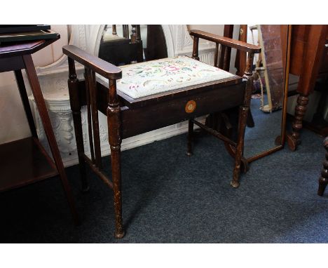 A beech framed music stool with hinged tapestry seat, 62cm