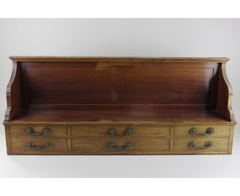 A 19th century mahogany shelf with six drawers below, 89cm