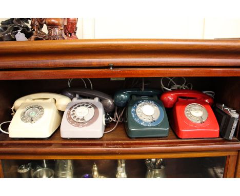Four vintage finger dial telephones, together with a German Dacora II camera in brown leather case