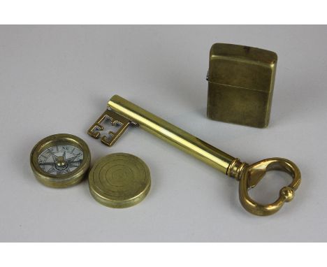 An unusual brass corkscrew in the form of a key, 13cm, a pocket compass and a cigarette lighter