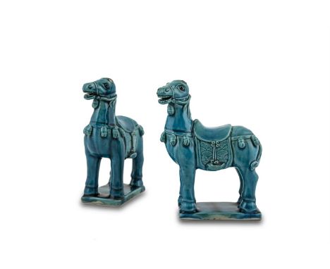 A PAIR OF CHINESE TURQUOISE GLAZED PORCELAIN MODELS OF HORSES, probably Kangxi Period, each inspired by the Tang Dynasty orig