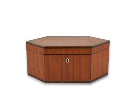A GEORGE III SATINWOOD AND CROSSBANDED TEA CADDY, c.1800, of lozenge shape, with a shield shaped ivory escutcheon, decorated 