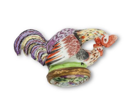 AN 18TH CENTURY CHELSEA PORCELAIN PATCH BOX, modelled as a cock and hen courting, painted with colourful plumage, with hinged