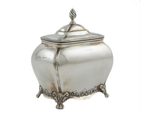 AN EDWARDIAN SILVER SHAPED RECTANGULAR TEA CADDY, Chester 1901, of bombé form, with hinged domed lid and flame finial, the ba