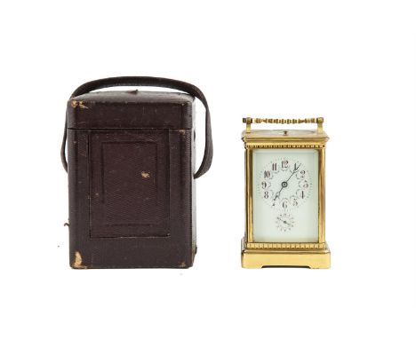 A FRENCH GILT BRASS CARRIAGE CLOCK, c.1900, with repeating movement, the rectangular case surmounted with swing handle, enclo