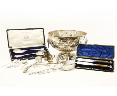 A silver plated punch bowl, with embossed detail together with a punch ladle and a collection of silver plated items, includi