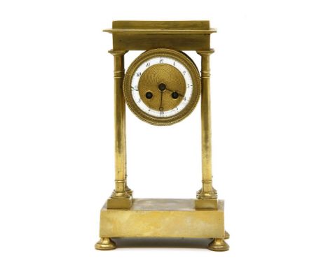 A small early 19th century French gilt portico clock, dial inscribed 'Collin Palais Royal No 166', 22cm high