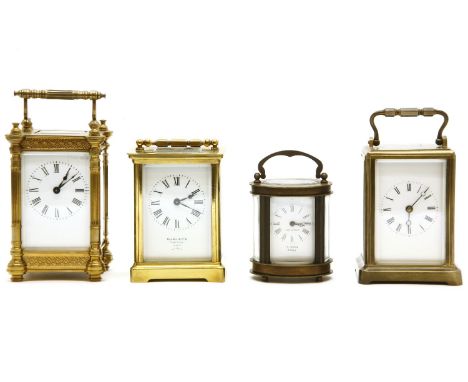 An early 20th century brass carriage clock, with bevelled glass sides, the white enamelled dial with Roman numerals, marked '