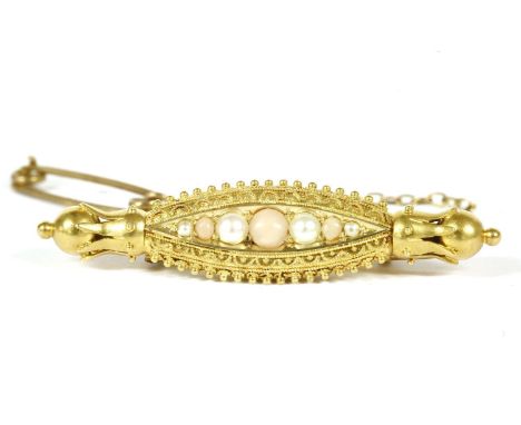 A Victorian Etruscan style gold coral and split pearl brooch, with beaded fringe and crown and ball finials, marked 15ct, 5.1