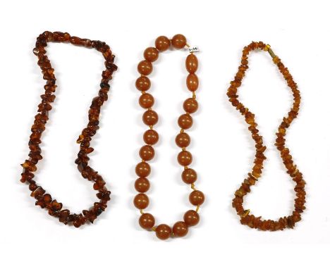 A single row circular jade bead necklace, strung knotted, a single row graduated toffee coloured Bakelite bead necklace with 