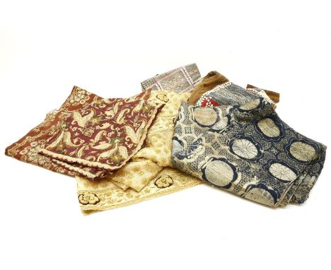 A collection of Indian and possibly Persian textiles, including a blue ground example woven with metallic design