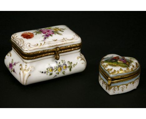 A late 19th/early 20th century porcelain and hand painted patch box, decorated with floral sprays, together with a further si