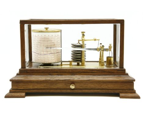 An oak cased barograph, with inscribed plaque 'W H H Gibson, A Record of Friendship and Appreciation of Valued Help In Resear