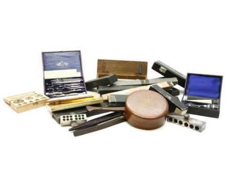 A quantity of scientific instruments, including slide rules, suppository makers, a billiard table spirit level, a cased pair 