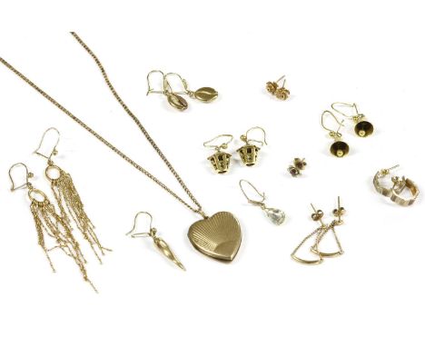 A 9ct gold heart shaped locket on chain, and seven gold earrings to include a pair of bi-colour hoop earrings marked 9ct, a p