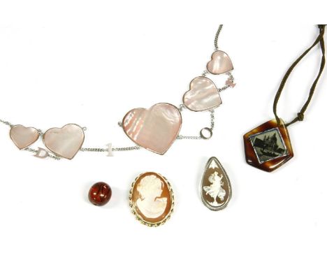 A Christian Dior pink shell heart centrepiece necklace, with pink shell and white metal fringe, in Dior pouch, a gold shell c