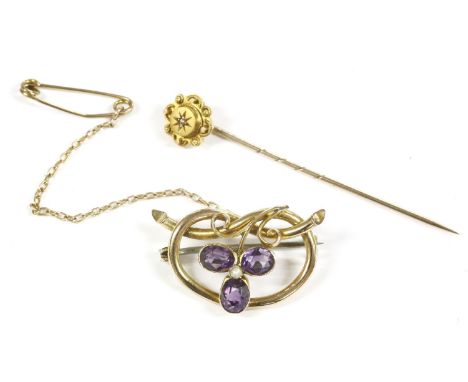 A gold split pearl and amethyst shamrock brooch, marked 9ct (pin not gold) 2.95g, a gold single stone diamond stick pin marke