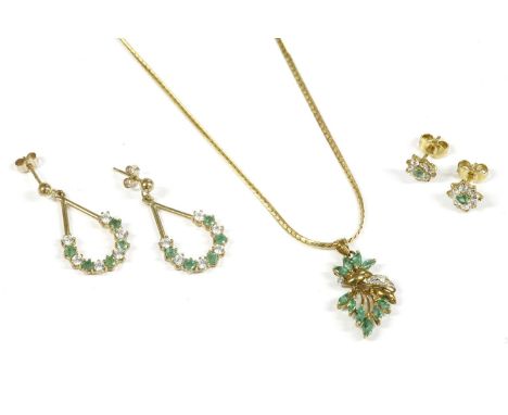 A pair of 9ct gold emerald and cubic zirconia drop earrings, an emerald and diamond spray cluster pendant, marked 14k, on a c