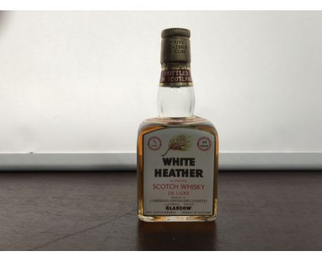 WHITE HEATHER 
Blended Scotch Whisky
4/5 pint, 94° proof. CONDITION REPORT: Good