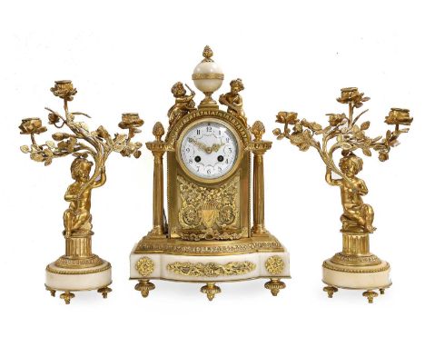 A French Ormolu and White Marble Striking Mantel Clock Garniture, circa 1900, case surmounted by cherubs and a central sphere