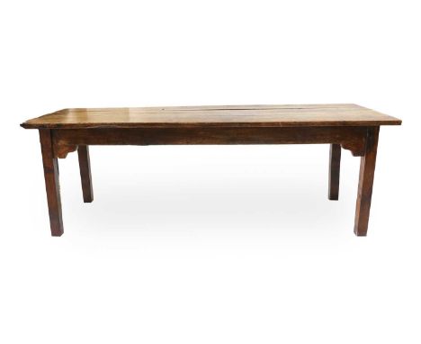 An Ash and Oak Joined Farmhouse Table, 19th century, of three-plank construction with moulded frieze, on square form block su