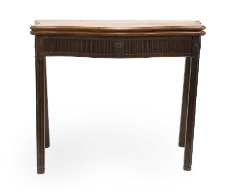 A George III Mahogany Chippendale Period Serpentine Foldover Card Table, 3rd quarter 18th century, the hinged leaf enclosing 